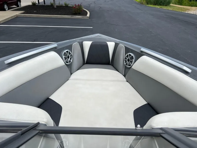 Slide: The Image of 2017 Tigé R21 boat interior with gray and white seating. - 8