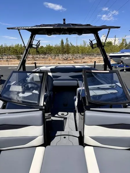 Slide: The Image of 2024 Axis A225 boat interior with open seating and modern design. - 10