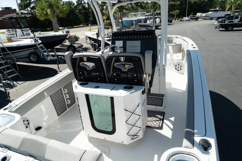 Slide: The Image of 2023 Wellcraft 242 Fisherman boat interior with seating and control console. - 10