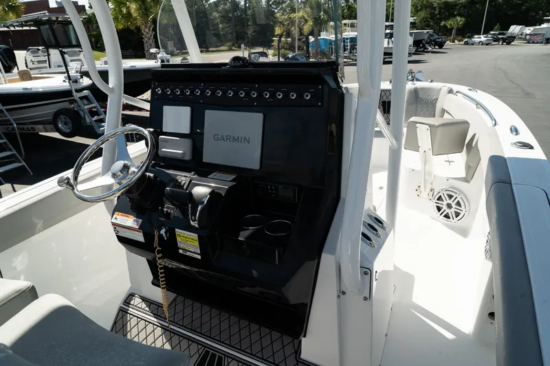 Slide: The Image of 2023 Wellcraft 242 Fisherman boat dashboard with Garmin navigation system. - 13