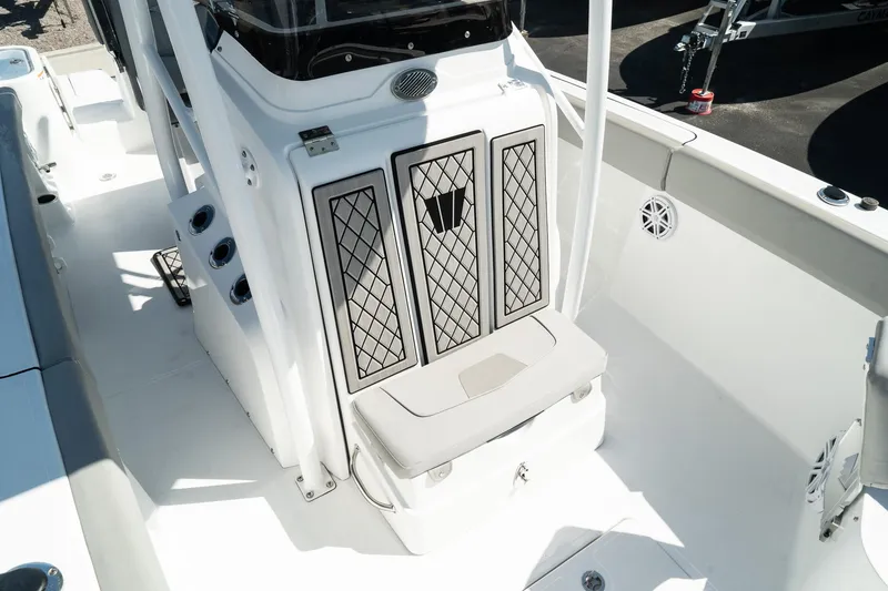 Slide: The Image of 2023 Wellcraft 242 Fisherman boat interior, featuring a clean, white deck and seating area. - 18