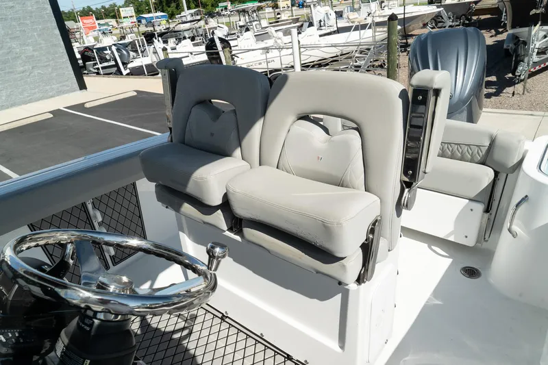 Slide: The Image of 2023 Wellcraft 242 Fisherman boat interior with dual captain seats. - 20