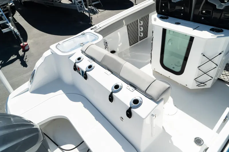 Slide: The Image of 2023 Wellcraft 242 Fisherman boat interior with seating and rod holders. - 8