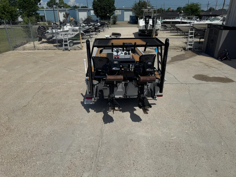 Slide: The Image of 2023 Pro-Drive 22x72 SBX boat in a marina, rear view. - 13