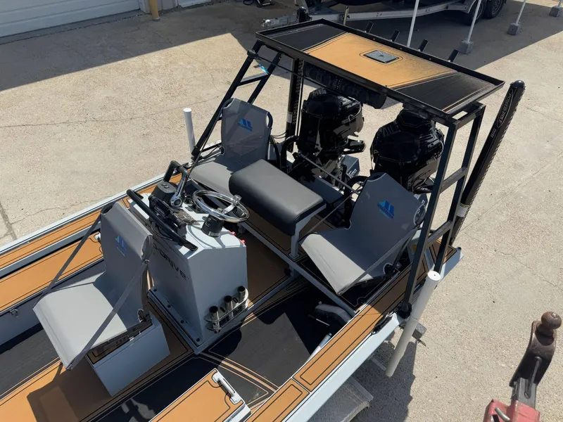 Slide: The Image of 2023 Pro-Drive 22x72 SBX boat with dual engines and seating, viewed from above. - 22