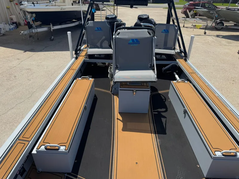 Slide: The Image of 2023 Pro-Drive 22x72 SBX boat interior with seating and storage compartments. - 24