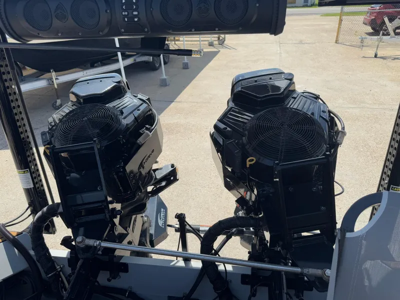 Slide: The Image of Twin Pro-Drive 22x72 SBX boat engines, 2023 model, on a trailer. - 27