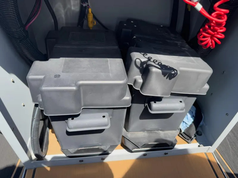 Slide: The Image of Battery compartment of 2023 Pro-Drive 22x72 SBX boat, featuring dual battery setup. - 31