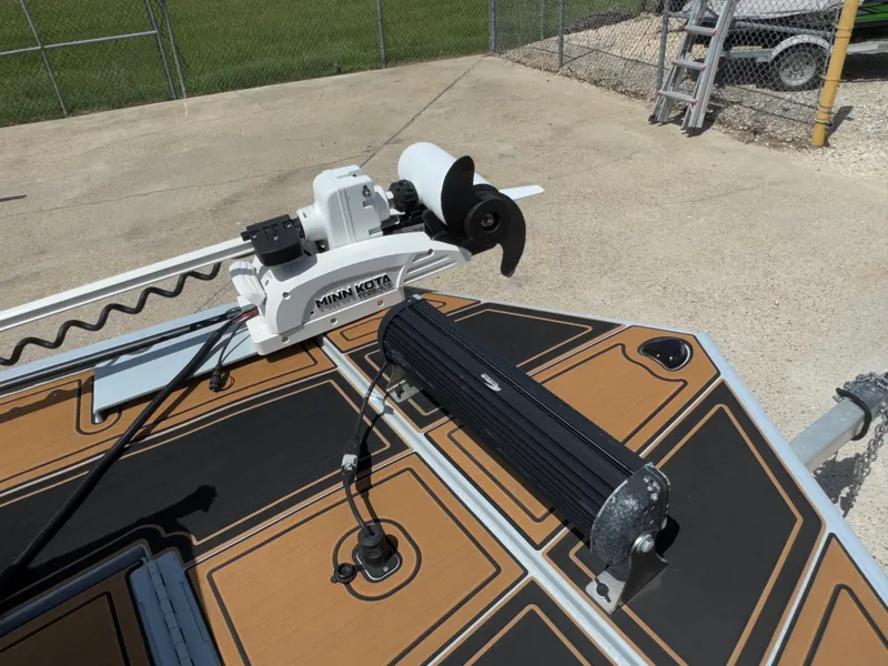 Slide: The Image of 2023 Pro-Drive 22x72 SBX boat with Minn Kota trolling motor on deck. - 8