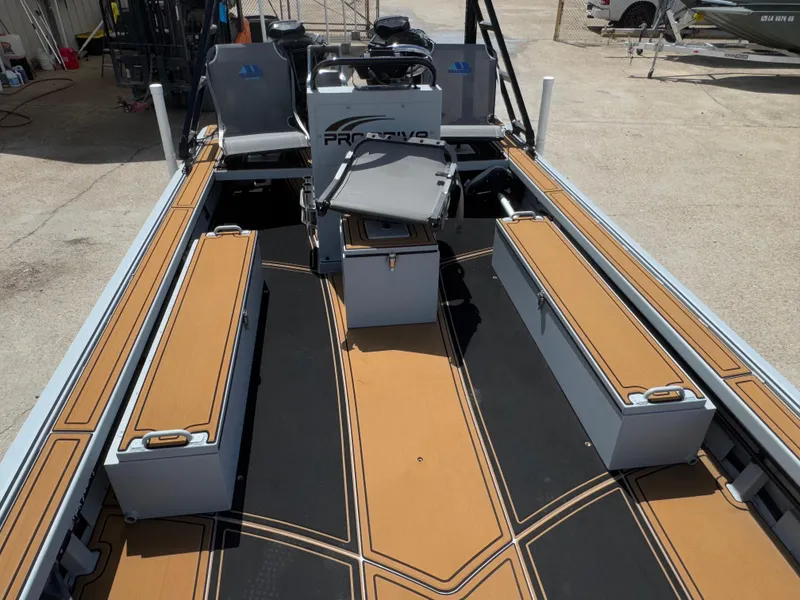 Slide: The Image of 2023 Pro-Drive 22x72 SBX boat interior with seating and storage compartments. - 9