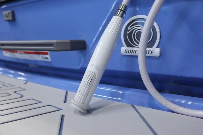 Slide: The Image of Close-up of 2024 Malibu 26 LSV boat's Surf Gate system and shower nozzle. - 11