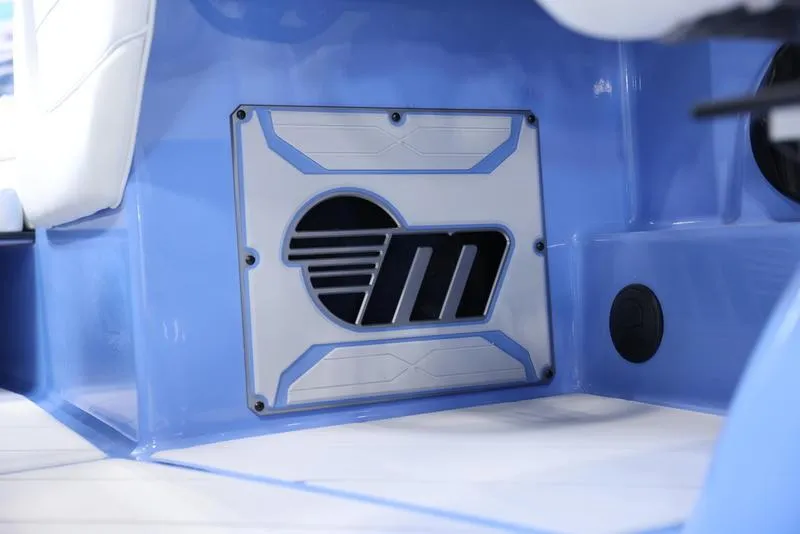 Slide: The Image of 2024 Malibu 26 LSV interior detail with custom blue panel and logo. - 15