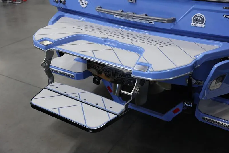 Slide: The Image of 2024 Malibu 26 LSV boat swim platform with fold-down step. - 6