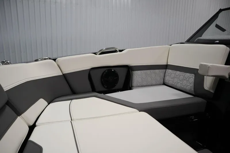Slide: The Image of 2024 Heyday H22 boat interior with white and gray cushioned seating. - 15