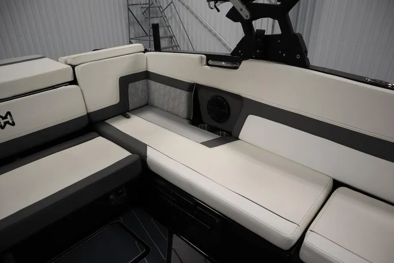 Slide: The Image of 2024 Heyday H22 boat interior with white and gray cushioned seating. - 18