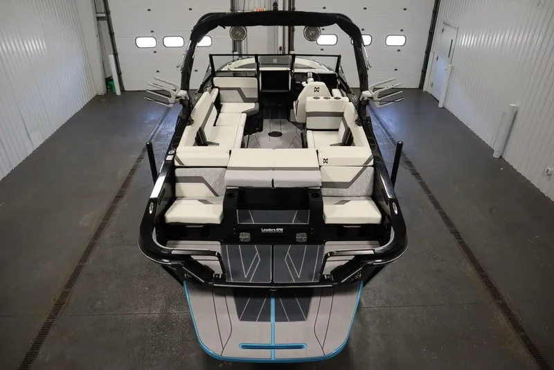 Slide: The Image of 2024 Heyday H22 boat interior with spacious seating in a garage. - 2