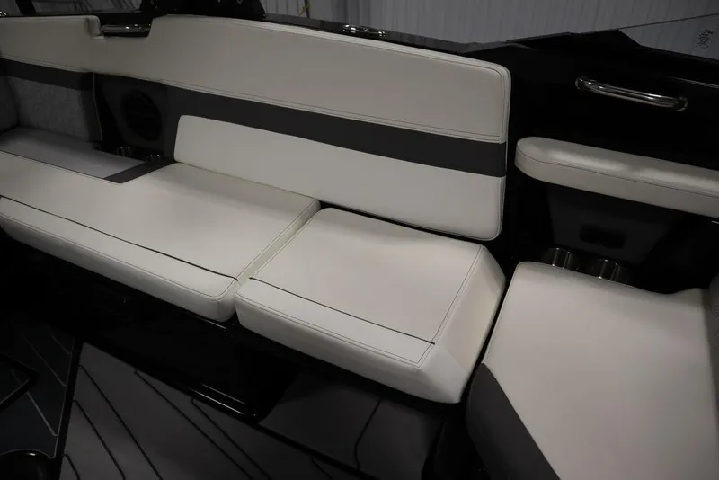 Slide: The Image of 2024 Heyday H22 boat interior with white cushioned seating. - 21