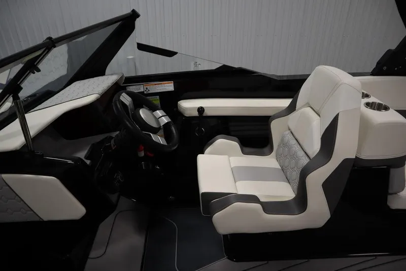 Slide: The Image of 2024 Heyday H22 boat interior with modern steering wheel and comfortable seating. - 23