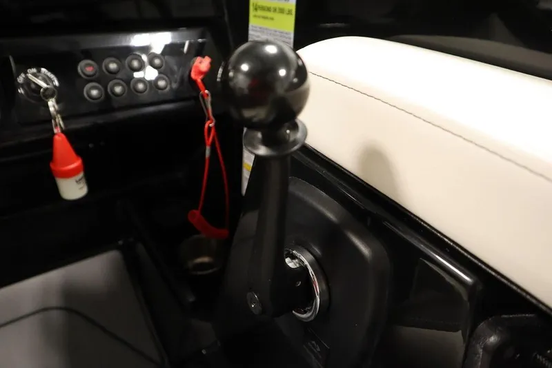 Slide: The Image of 2024 Heyday H22 boat control panel with throttle lever and safety lanyard. - 4