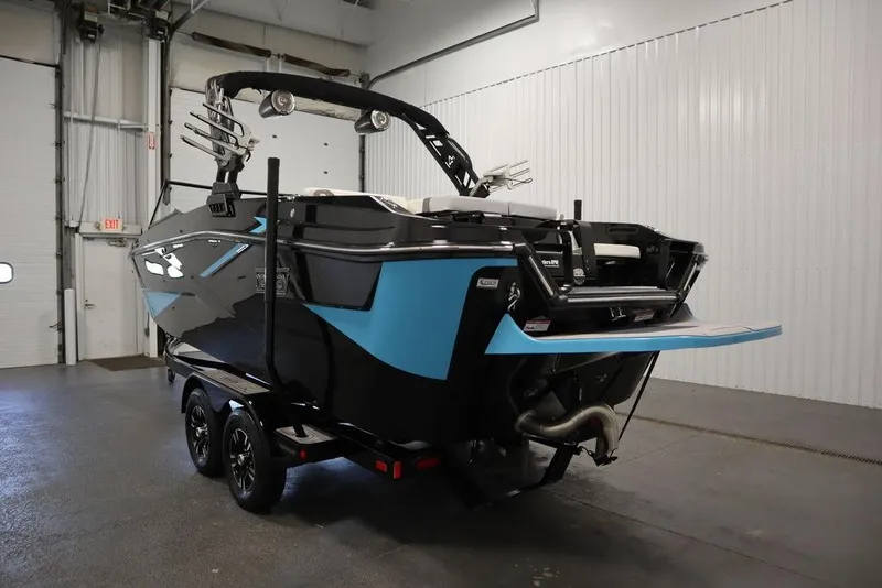 Slide: The Image of 2024 Heyday H22 boat in a showroom, rear view with blue and black design. - 40