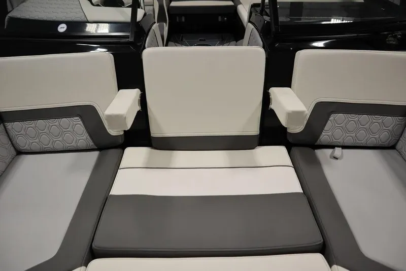 Slide: The Image of 2024 Heyday H22 boat interior with gray and white cushioned seating. - 42
