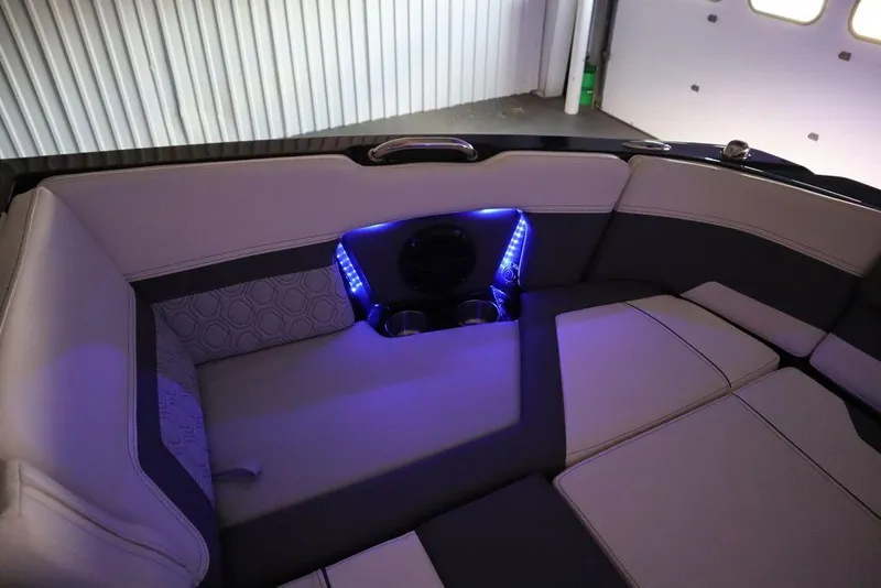 Slide: The Image of 2024 Heyday H22 boat interior with LED lighting and cushioned seating. - 43