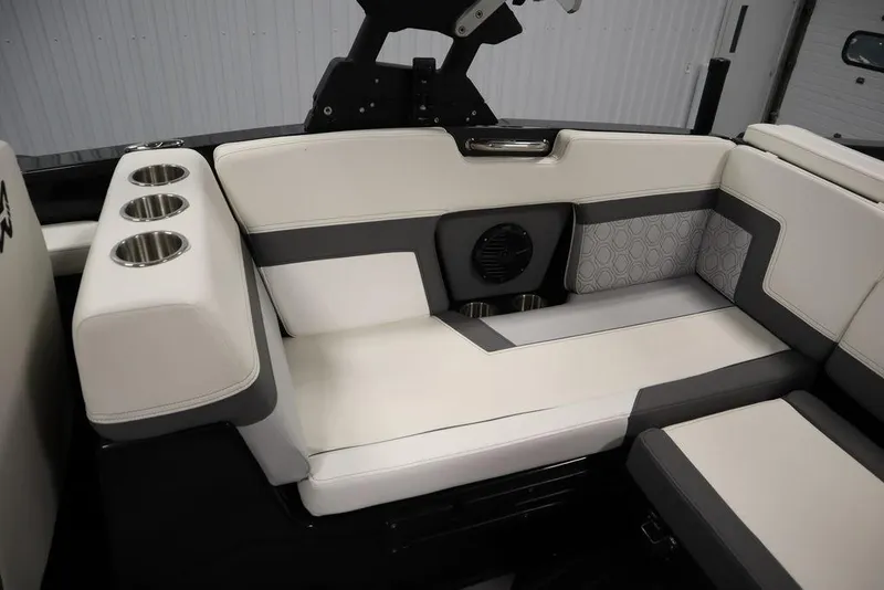 Slide: The Image of 2024 Heyday H22 boat interior with cushioned seating and cup holders. - 45
