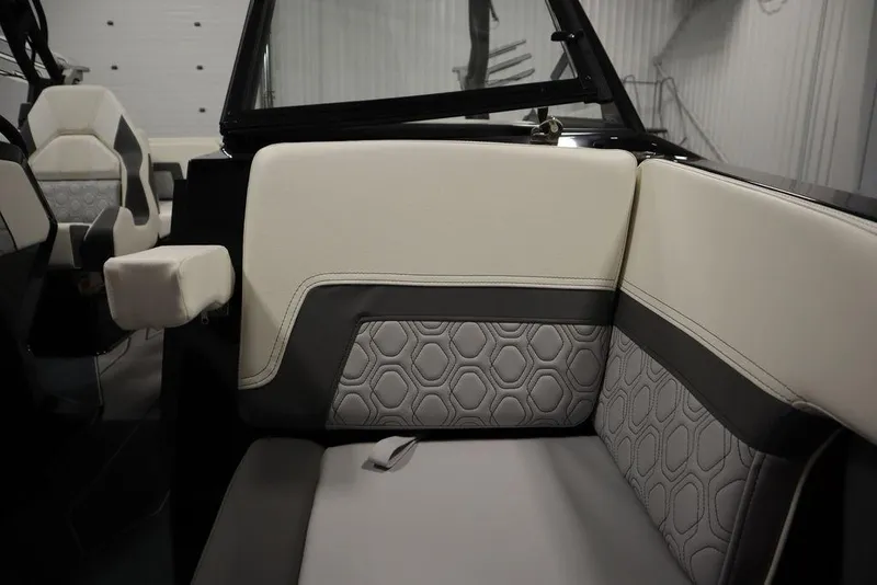 Slide: The Image of 2024 Heyday H22 boat interior with modern, hexagonal-patterned upholstery. - 49