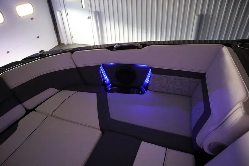 Slide: The Image of 2024 Heyday H22 boat interior with LED lighting and cushioned seating. - 7