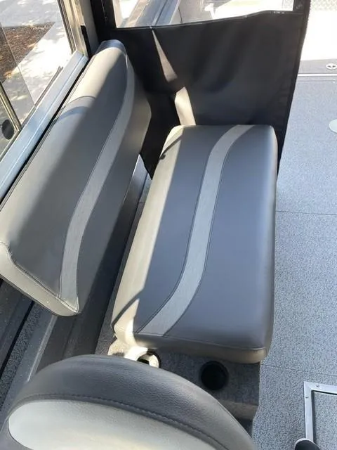 Slide: The Image of 2024 Spartan 220 Maximus interior seating with gray upholstery and modern design. - 10