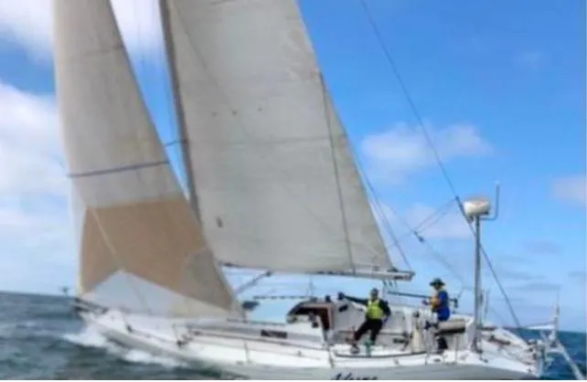 Slide: The Image of 1988 Beneteau First Class 12 sailboat docked in a calm marina. - 2