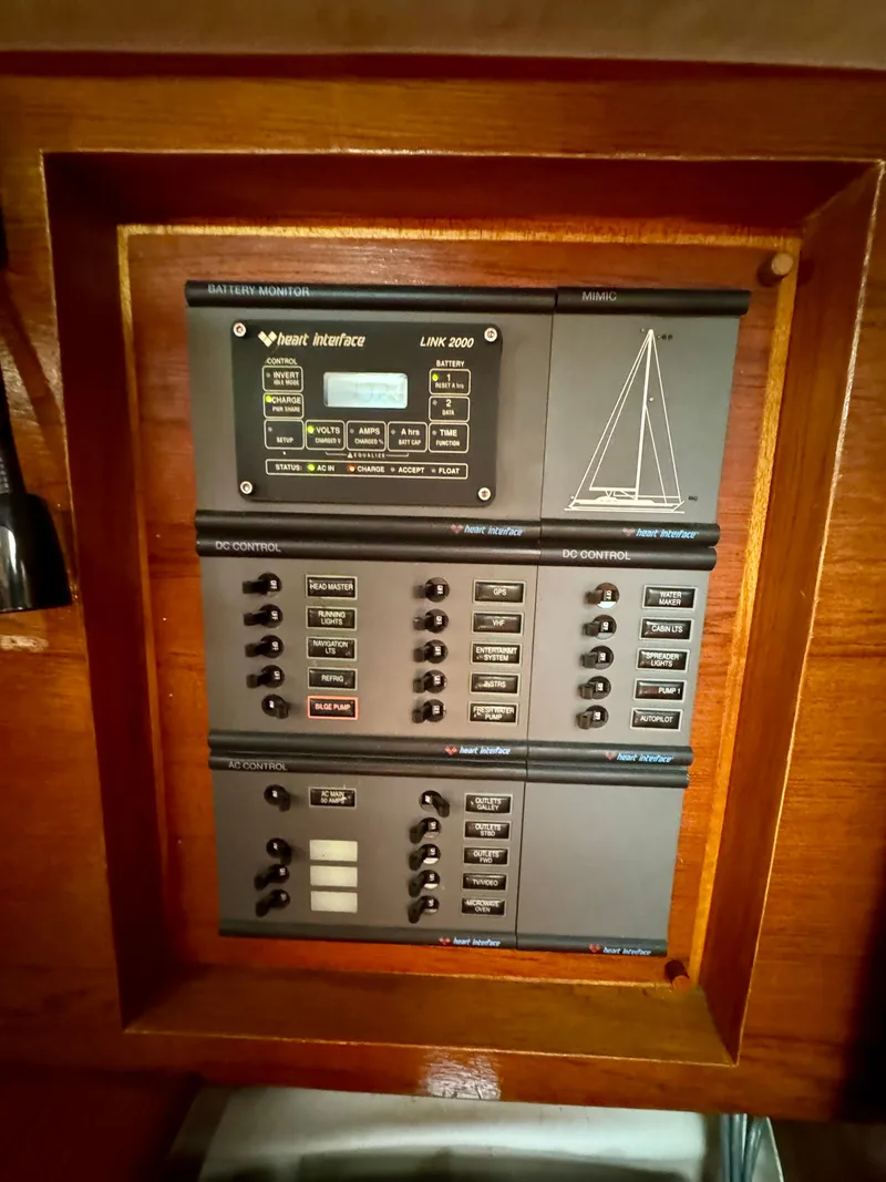 Slide: The Image of 1988 Beneteau First Class 12 sailboat docked in a marina, surrounded by other boats. - 8