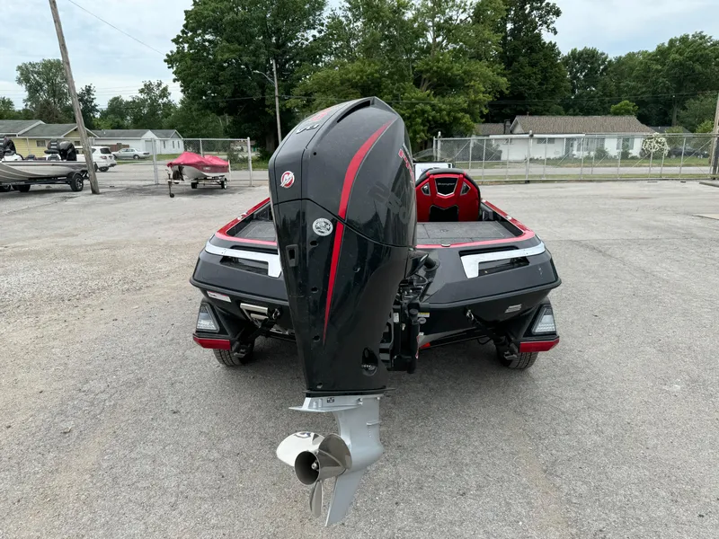 Slide: The Image of 2024 Ranger Z521R Ranger Cup Equipped boat with powerful outboard motor, parked outdoors. - 10