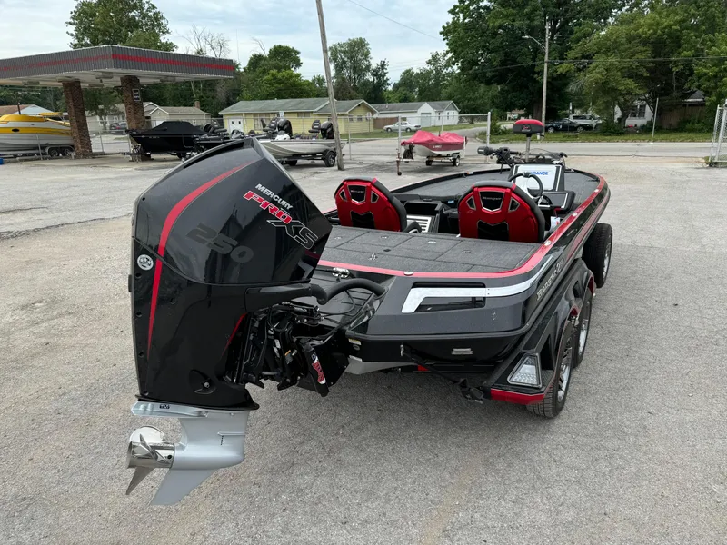 Slide: The Image of 2024 Ranger Z521R Ranger Cup Equipped boat with powerful engine, parked outdoors. - 11