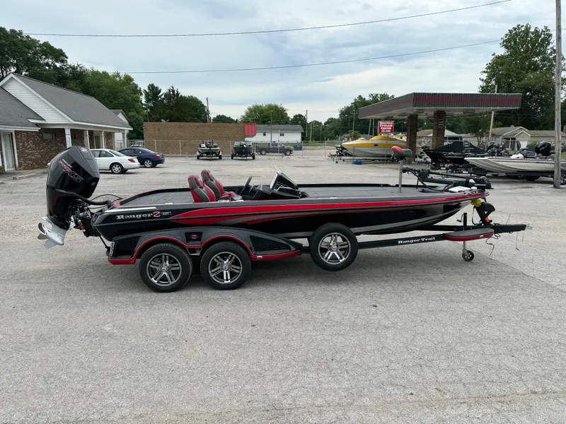 Slide: The Image of 2024 Ranger Z521R Ranger Cup Equipped boat on trailer in parking lot. - 12
