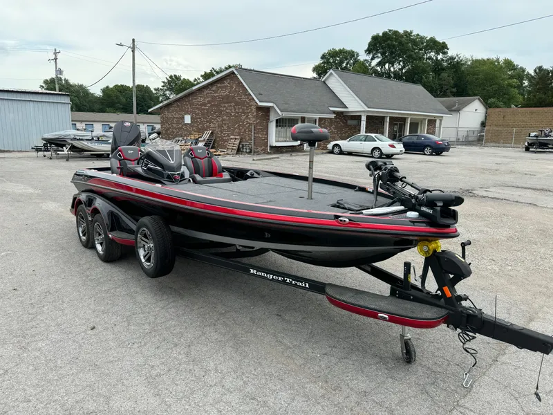 Slide: The Image of 2024 Ranger Z521R Ranger Cup Equipped boat on trailer in parking lot. - 13