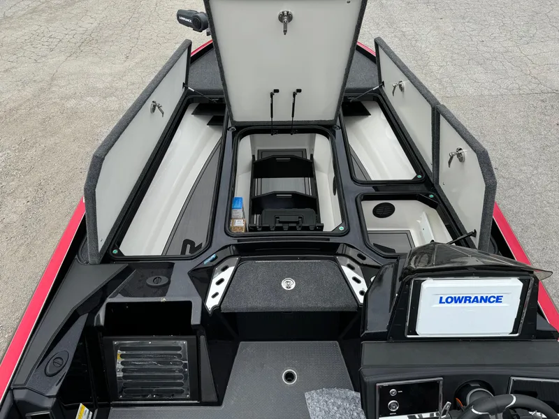 Slide: The Image of 2024 Ranger Z521R boat interior with open storage compartments and Lowrance electronics. - 20