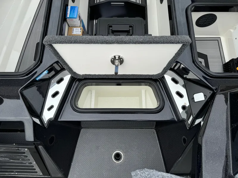 Slide: The Image of 2024 Ranger Z521R Ranger Cup Equipped boat storage compartment, open lid, organized interior. - 21