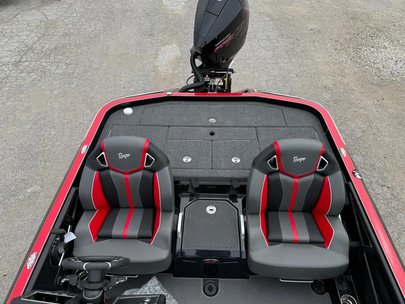 Slide: The Image of 2024 Ranger Z521R boat interior with dual seats and motor, showcasing sleek design. - 24