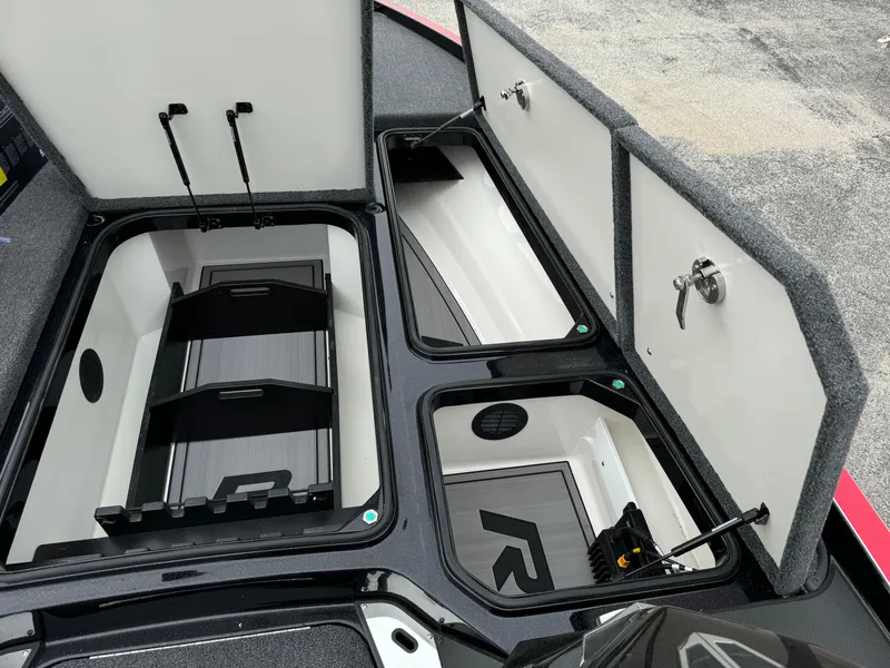 Slide: The Image of 2024 Ranger Z521R Ranger Cup Equipped boat storage compartments open, showcasing organized interior. - 7