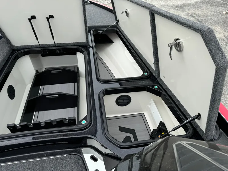 Slide: The Image of 2024 Ranger Z521R boat storage compartments open, showcasing organized interior space. - 8