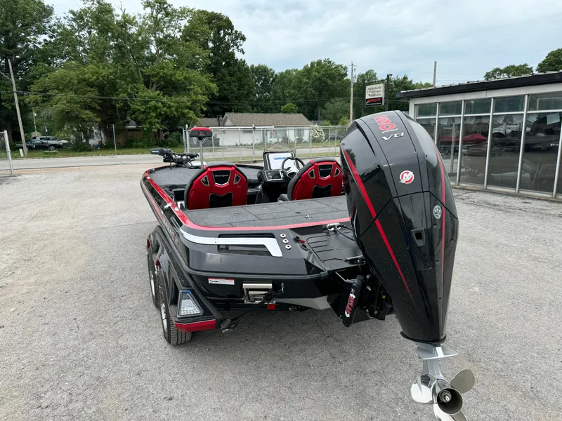 Slide: The Image of 2024 Ranger Z521R boat with powerful outboard motor, parked outdoors. - 9