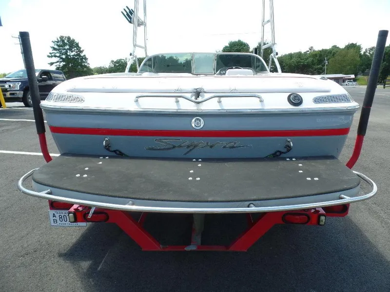 Slide: The Image of 2003 Supra 21 boat rear view with swim platform and trailer. - 3