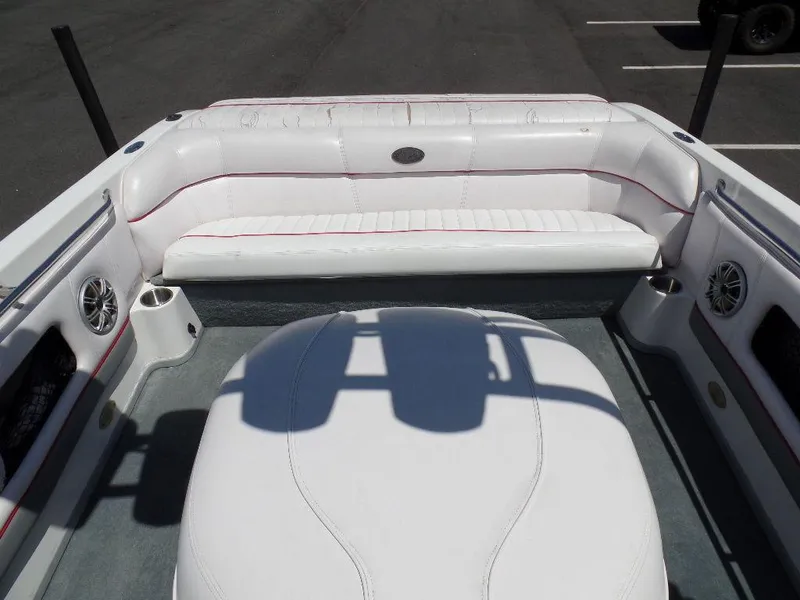 Slide: The Image of Interior of a 2003 Supra 21 boat with white seating and speakers. - 5