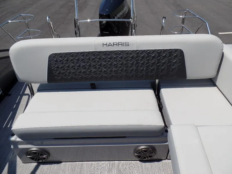 Slide: The Image of 2025 Harris Solstice 250 boat seating with stylish upholstery and integrated speakers. - 13