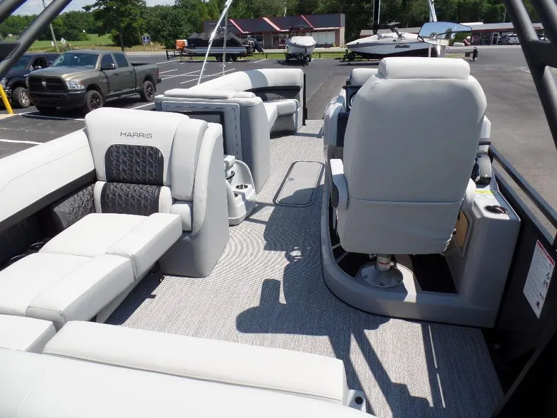 Slide: The Image of 2025 Harris Solstice 250 pontoon boat interior with plush seating and modern design. - 15