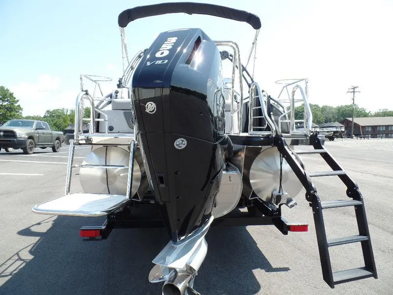 Slide: The Image of 2025 Harris Solstice 250 boat with powerful outboard motor and sleek design. - 3