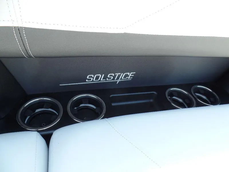 Slide: The Image of 2025 Harris Solstice 250 interior with cup holders and "Solstice" branding. - 6