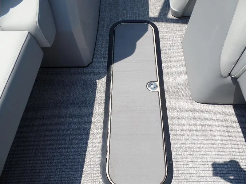 Slide: The Image of 2025 Harris Solstice 250 boat interior with sleek storage compartment and modern seating. - 8