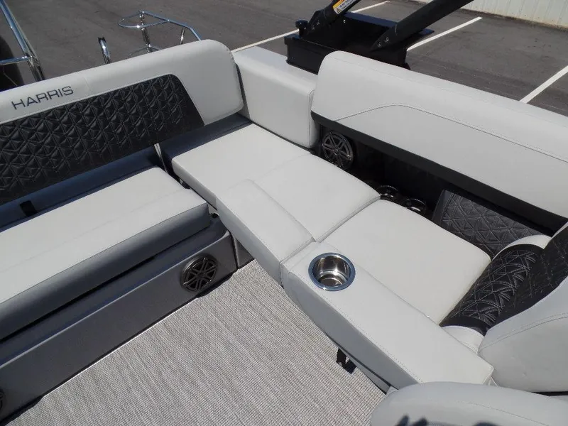 Slide: The Image of 2025 Harris Solstice 250 boat interior with luxurious seating and cup holder. - 9